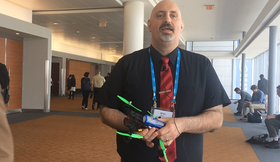 Brian Martin holding a drone he used to in 2017 to demonstrate Creo piping and cabling tools.